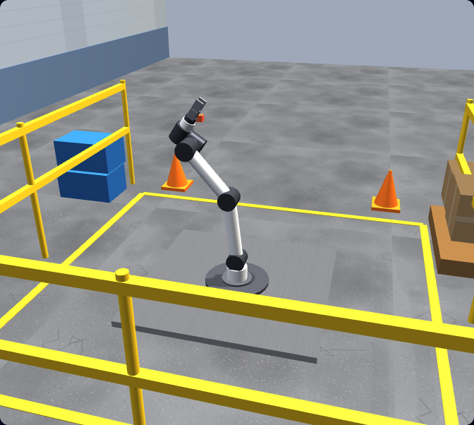 A Universal Robots–style six-axis arm standing in a 3D factory cell in the browser-based UR simulator, with a parts table, safety railing and pallet.